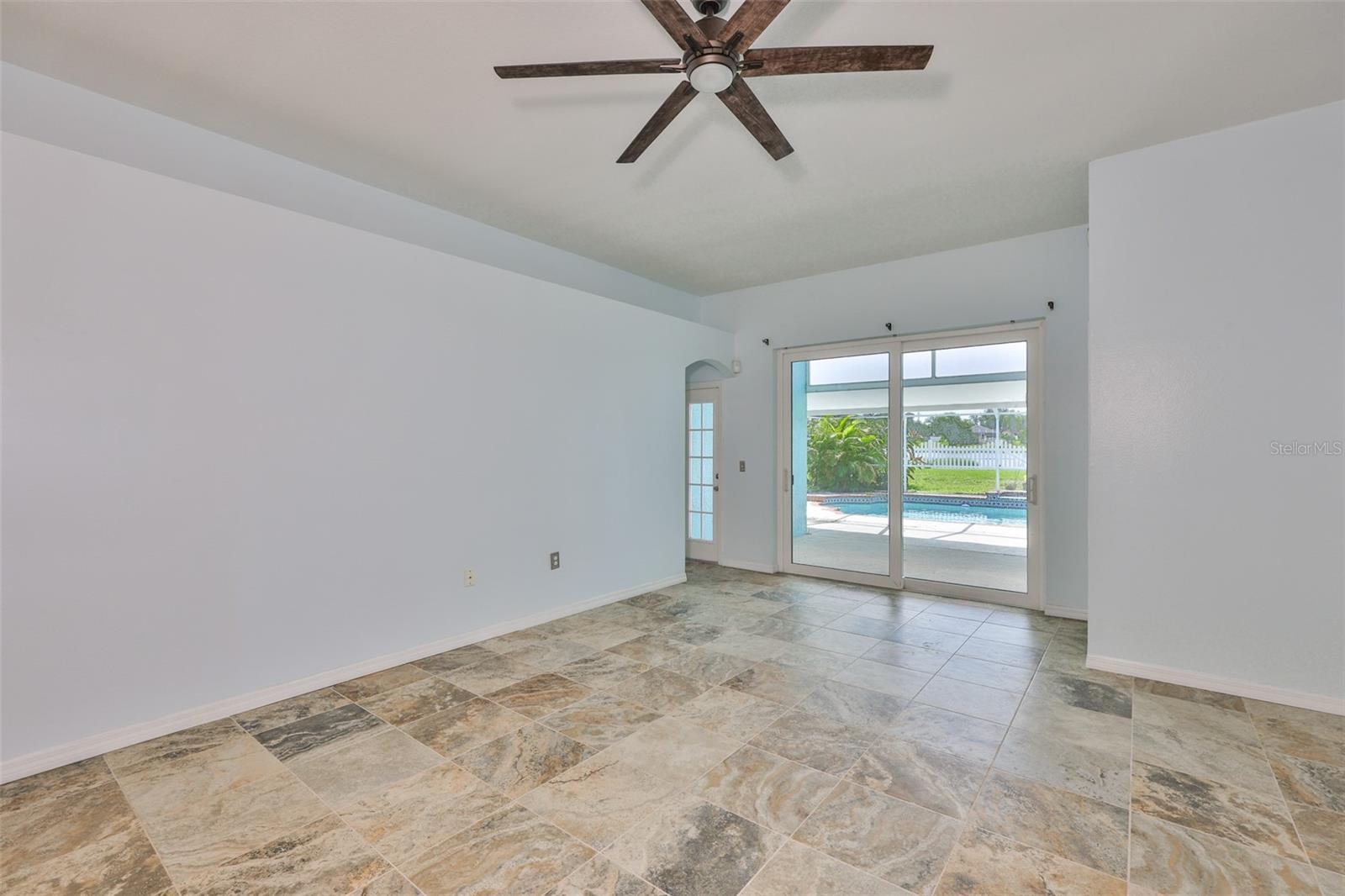 Great Room to lanai and pool, hurricane sliders, pool door, bedrooms 2 and 3 and bathroom 2 on far left