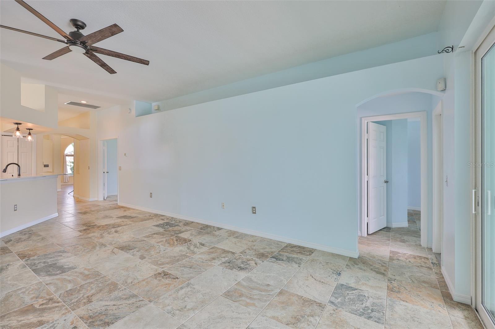 Great Room, bedrooms 2 and 3, bathroom 2 right center. Bedroom 4 with French Doors left center.