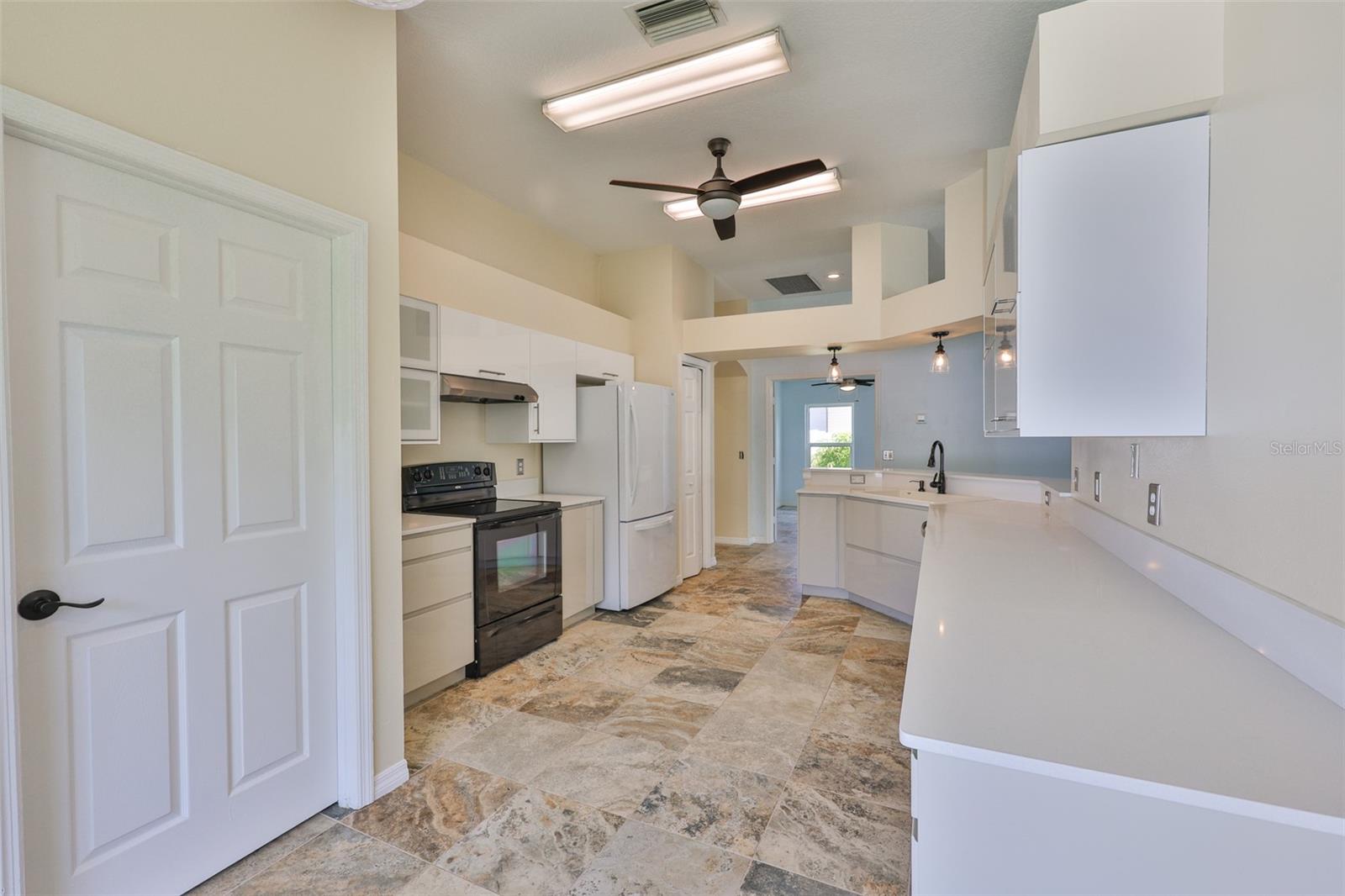 Laundry room door on left, pantry far left from Dinette