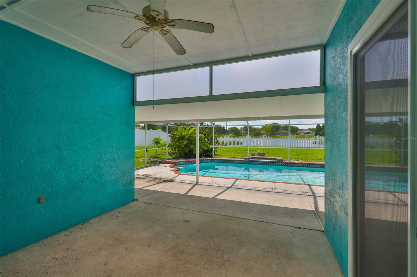 Covered lanai area, sliders to right and behind