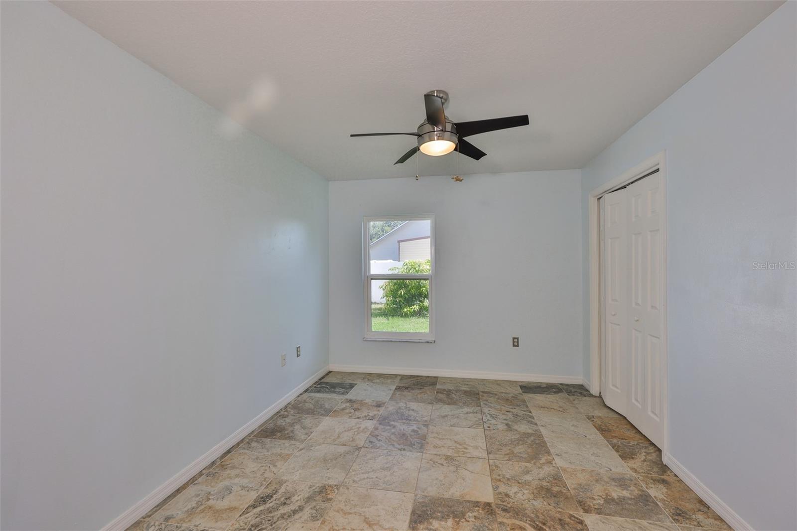 Bedroom 4; can easily be an office, playroom or media room with the French Doors