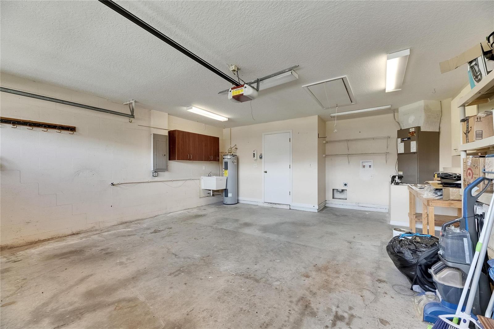 Utility sink and water heater in garage