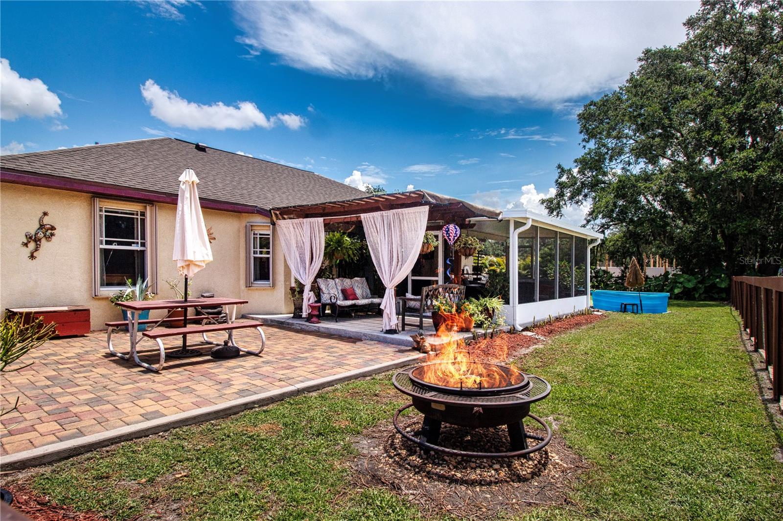 Back patio pergola and lanai. Perfect for entertaining.