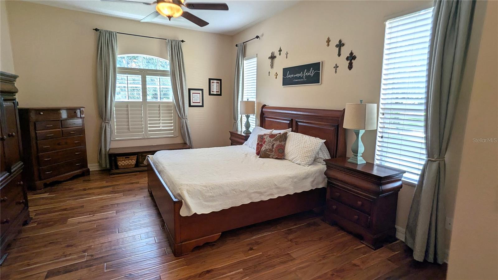 Primary bedroom with plantation shutters.