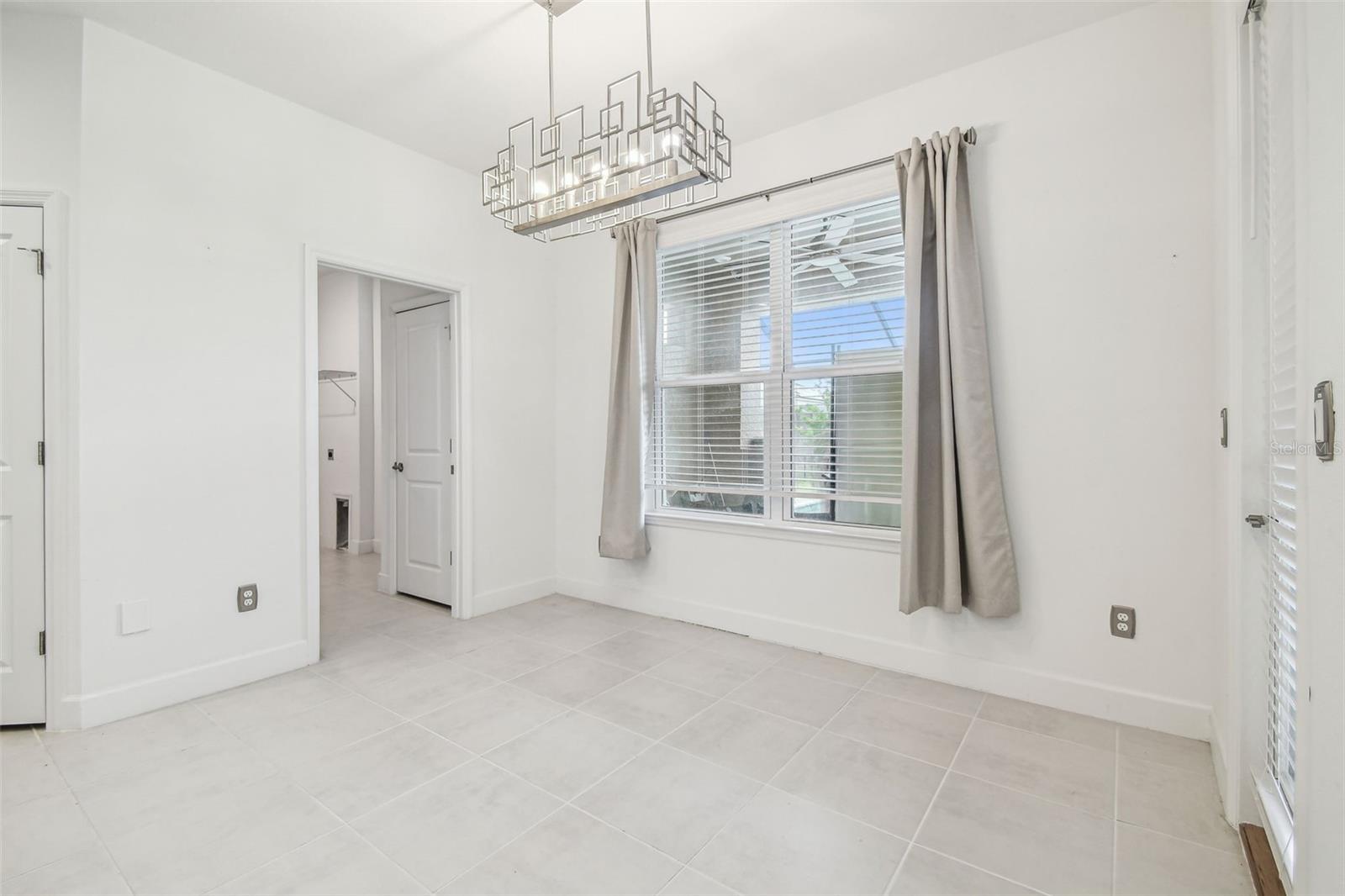 dining nook leads to laundry room