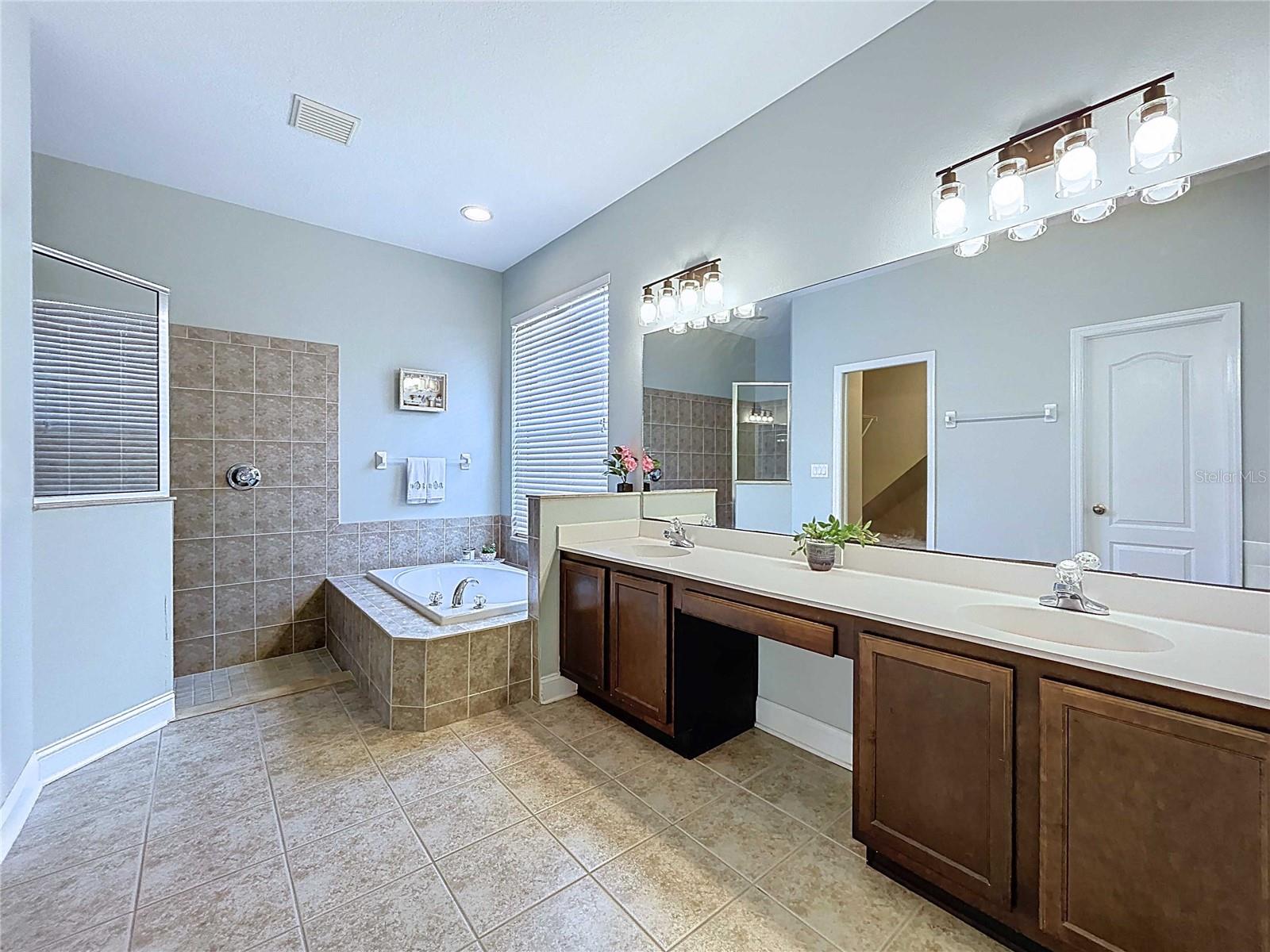 Primary bathroom with garden tub & shower