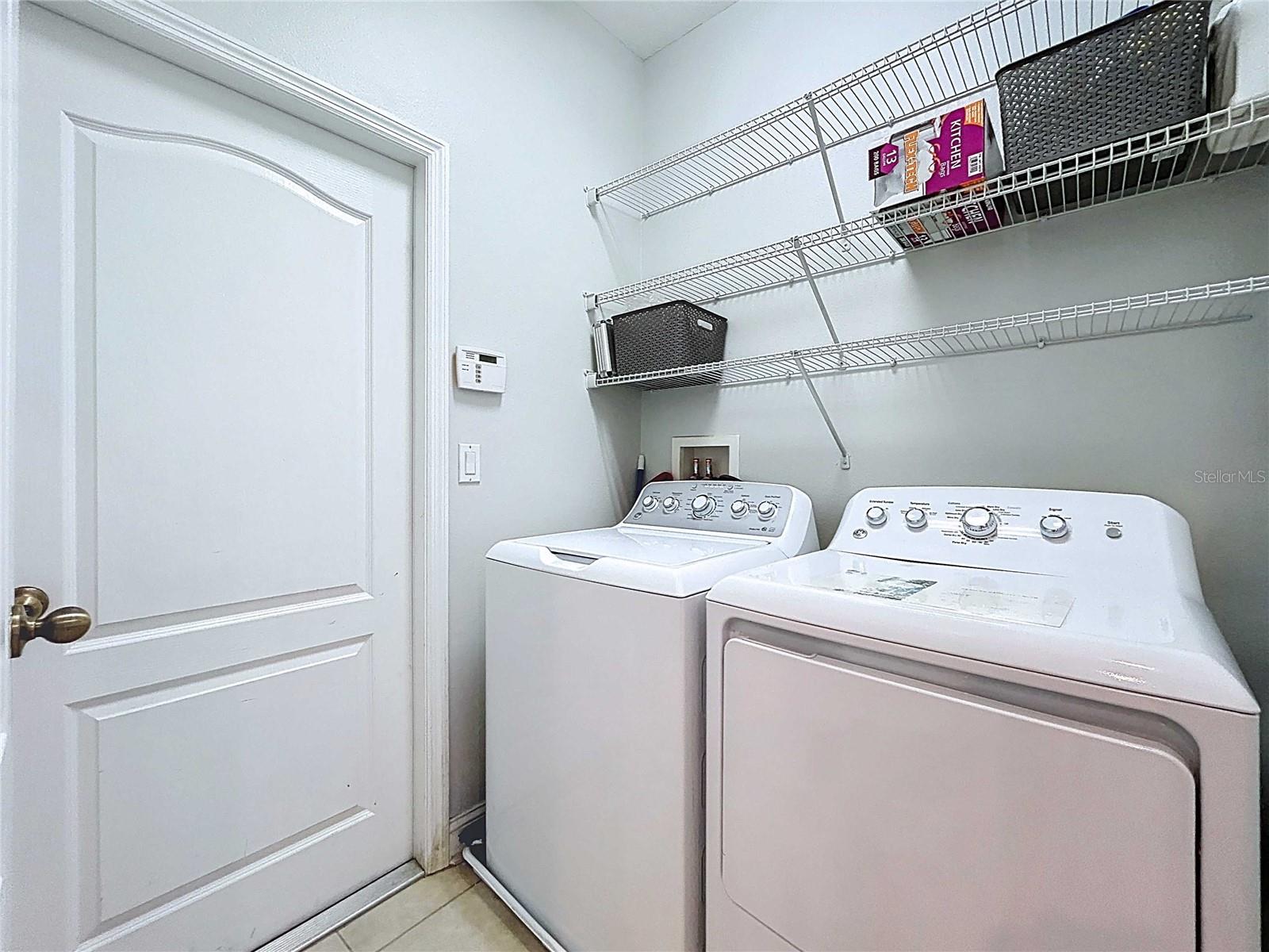 Laundry room with entrance to garage