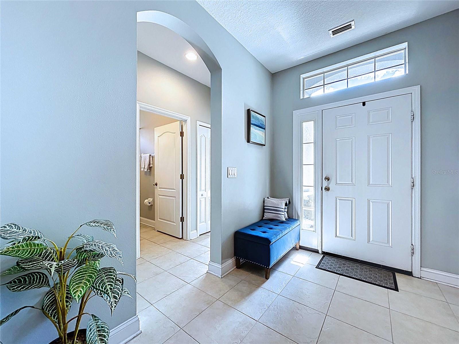 Interior front foyer area with entrance to secondary bedrooms on left