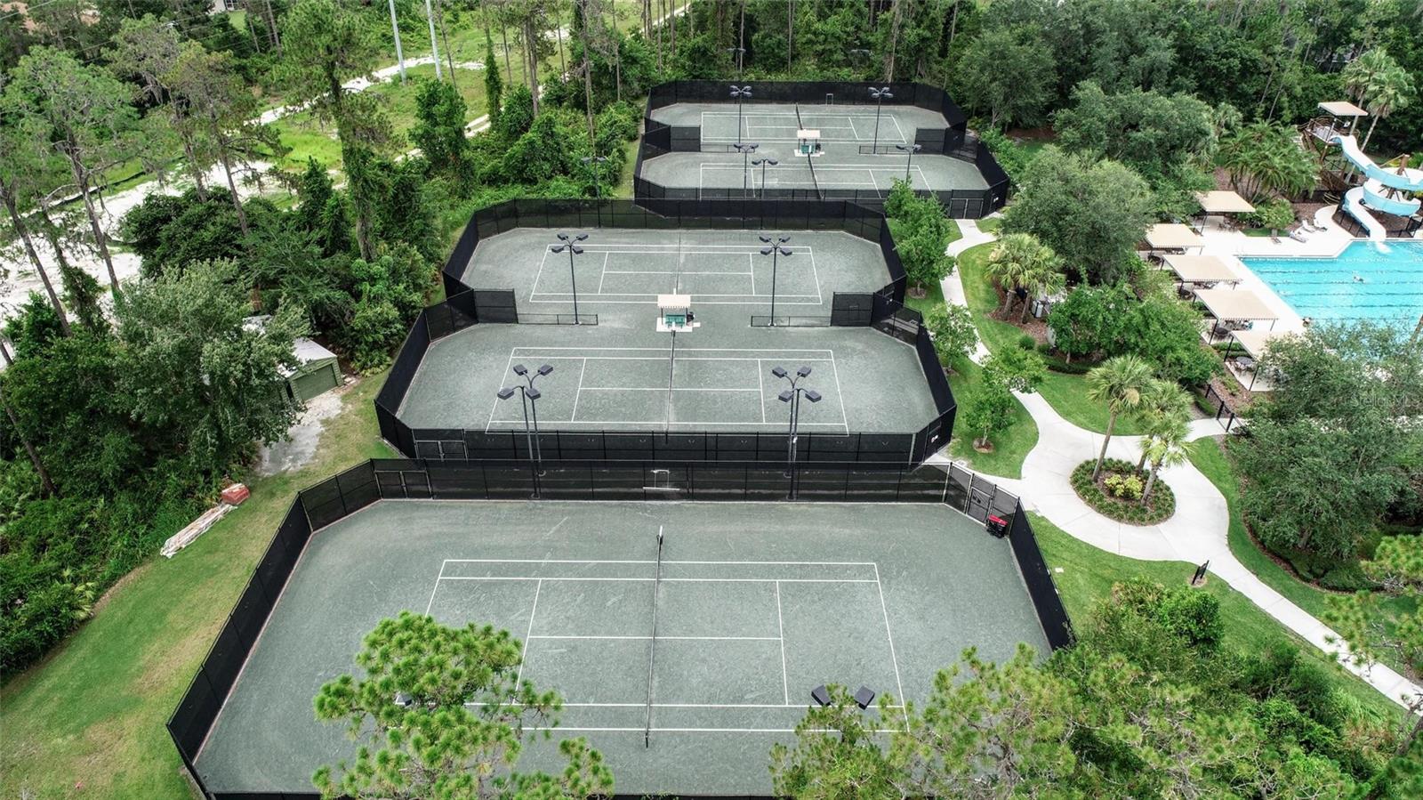 Five lighted cinder surface tennis courts