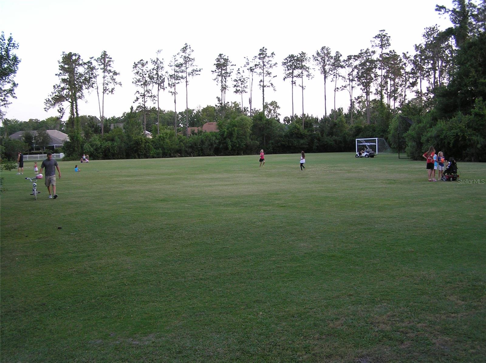 Athletic fields also featuring baseball backstop