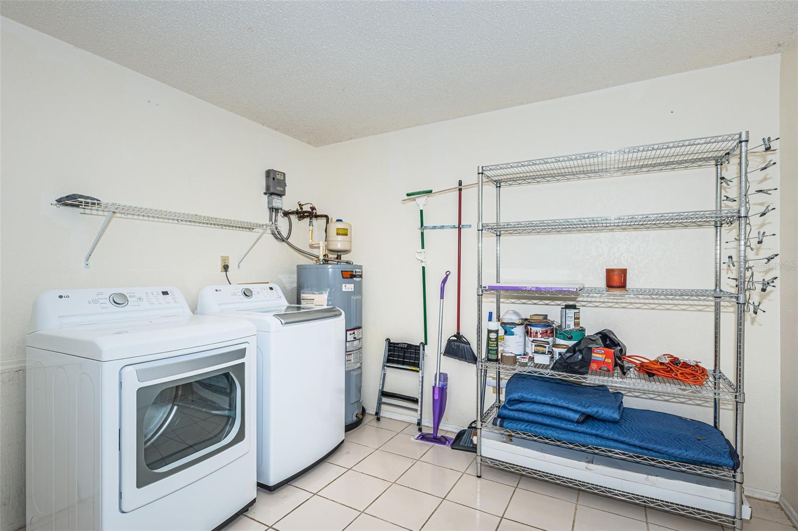 1st floor large utility room w/ newer full-size washer/dryer & water heater