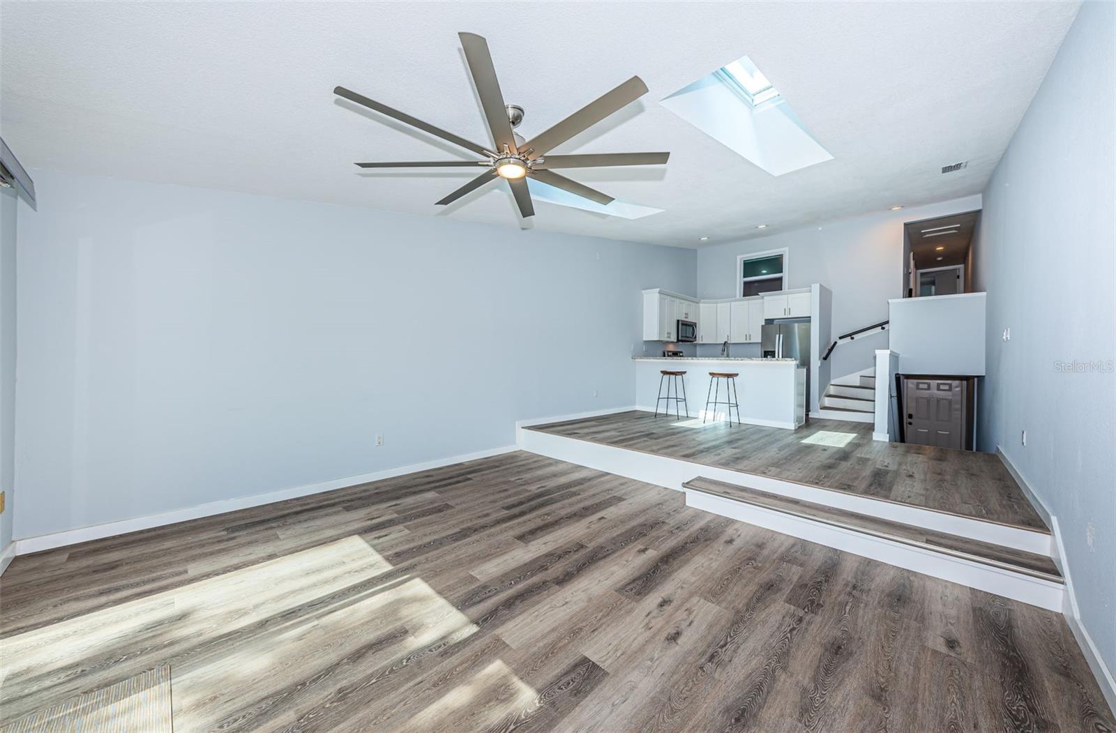 Kitchen, dining area, great room & stairs going up to the bedrooms/bathrooms