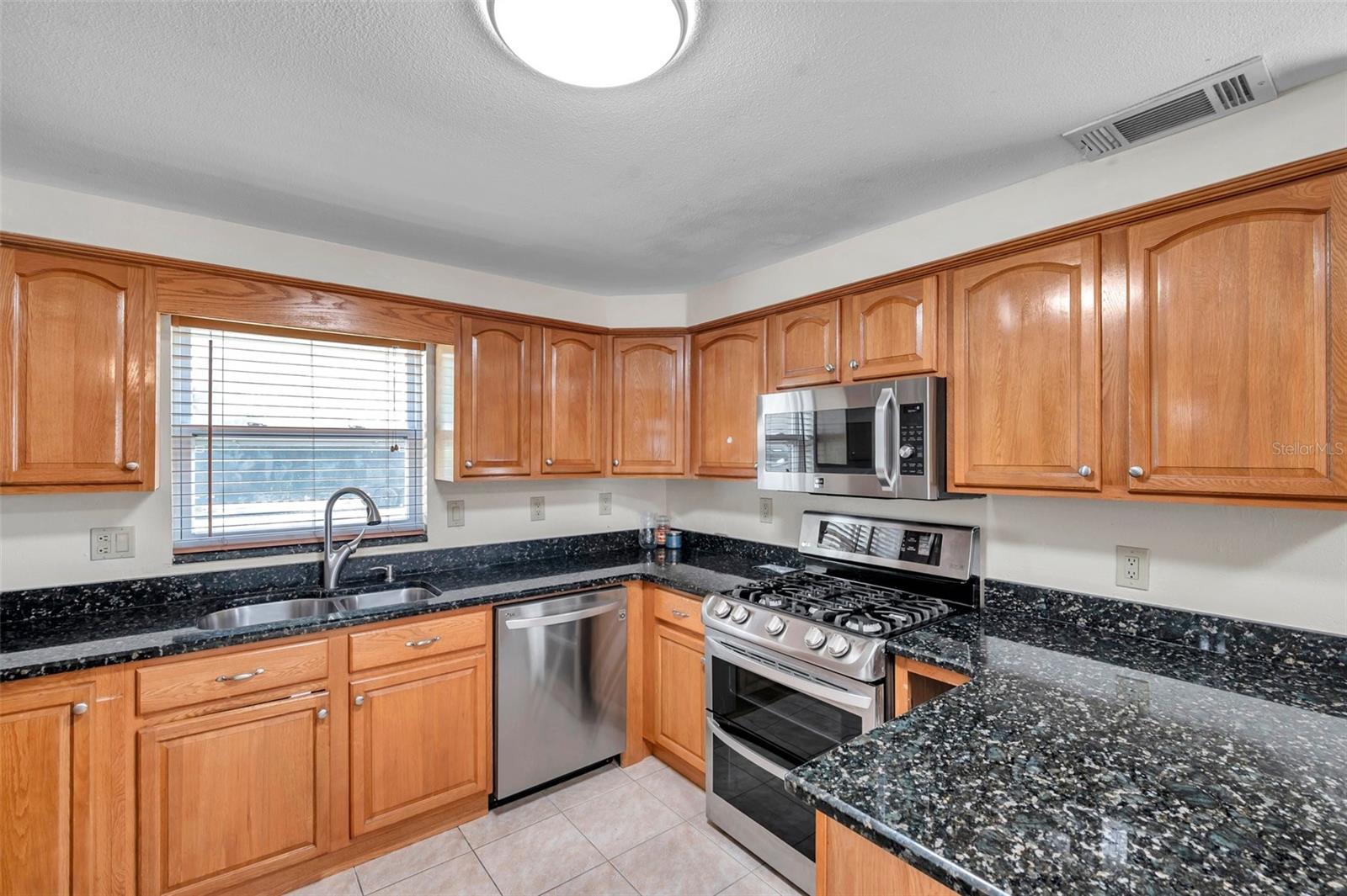 Note the gas range with double oven.