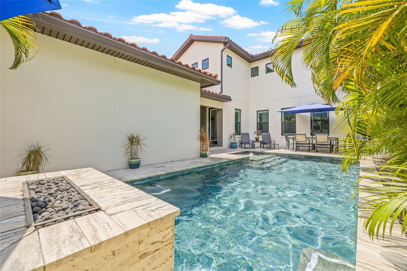 Outdoor entertainer's dream. A heated, chilled and saltwater pool with a gas firepit.