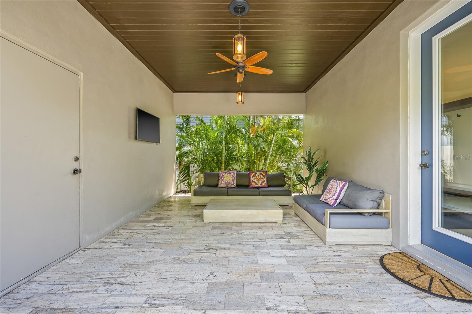 Outdoor breezeway between the garage and back door.