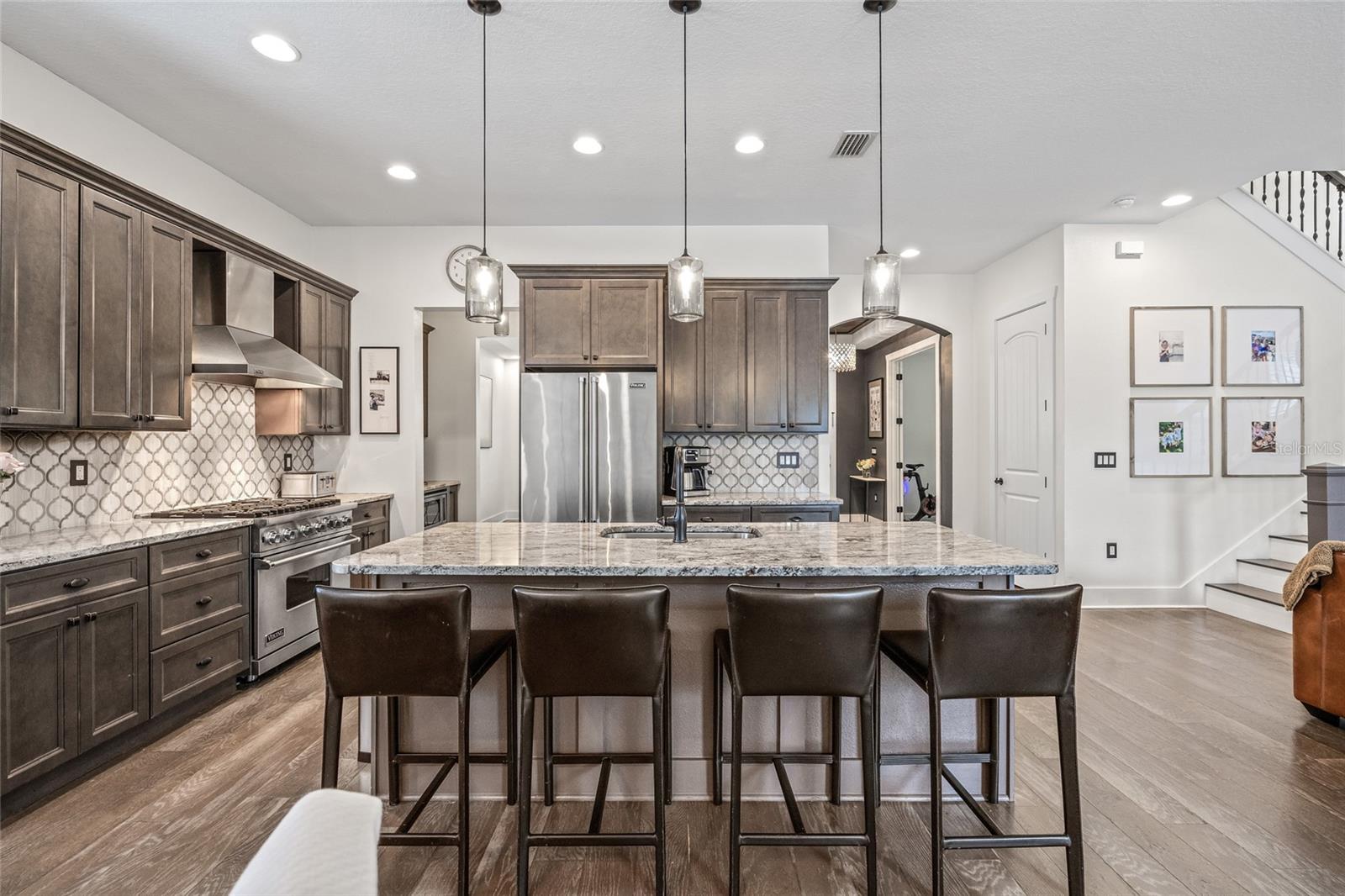 Dreamy open-concept kitchen with large center island and breakfast bar.