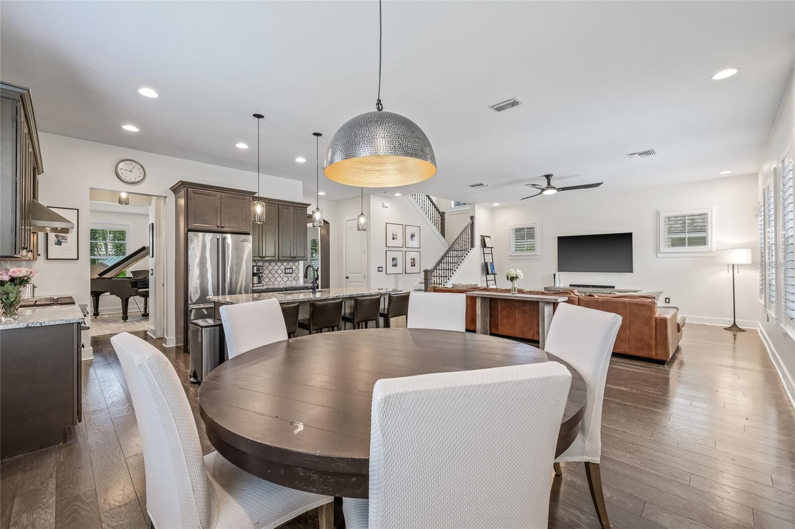 The kitchen anchors down two dining areas. A dinette toward the rear of the home and a formal dining toward the front.