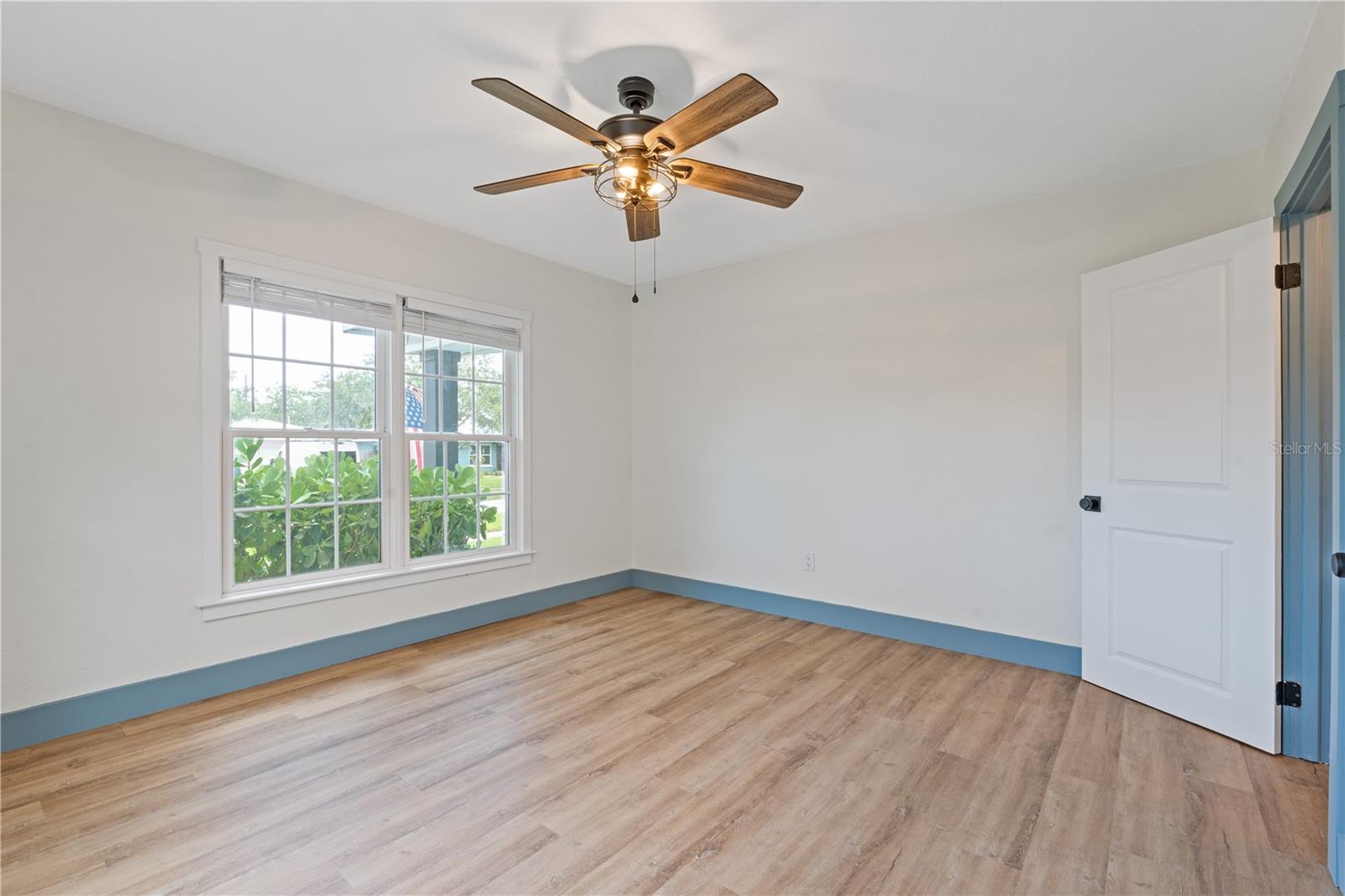 Bedroom 2 with view of the front of the home