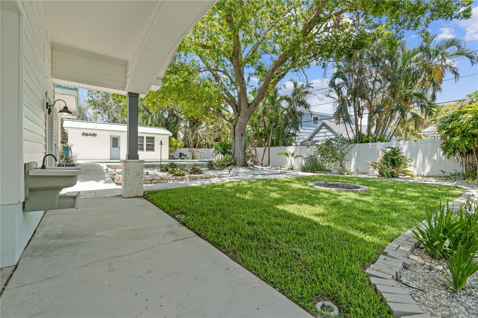 Back yard with access to the back side of the oversized 2 car detached garage.