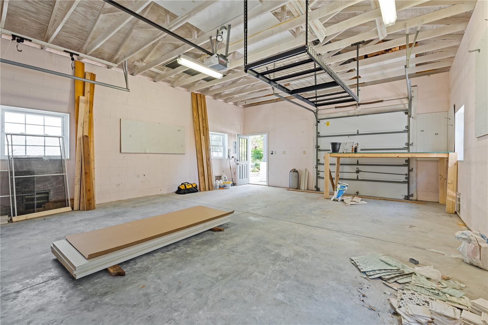 Check out this huge man-cave.  This oversized 2 car garage also has a door opening to the rear of the garage as well as a service door.