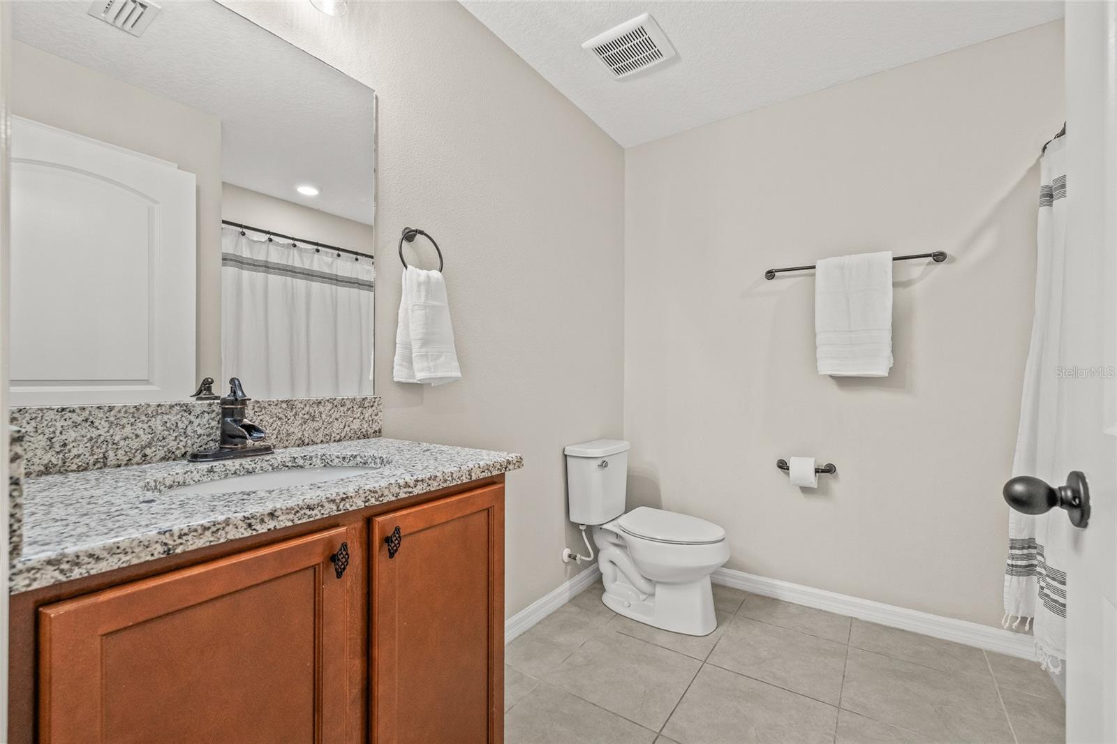 The guest bathroom is between bedroom #2 and #3.