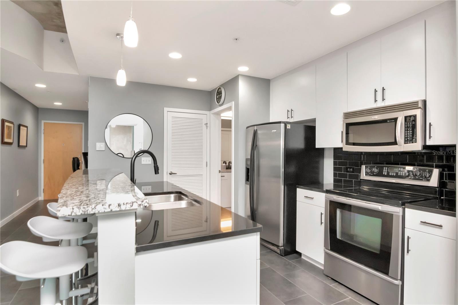 Kitchen with Bar Seating for Entertainment