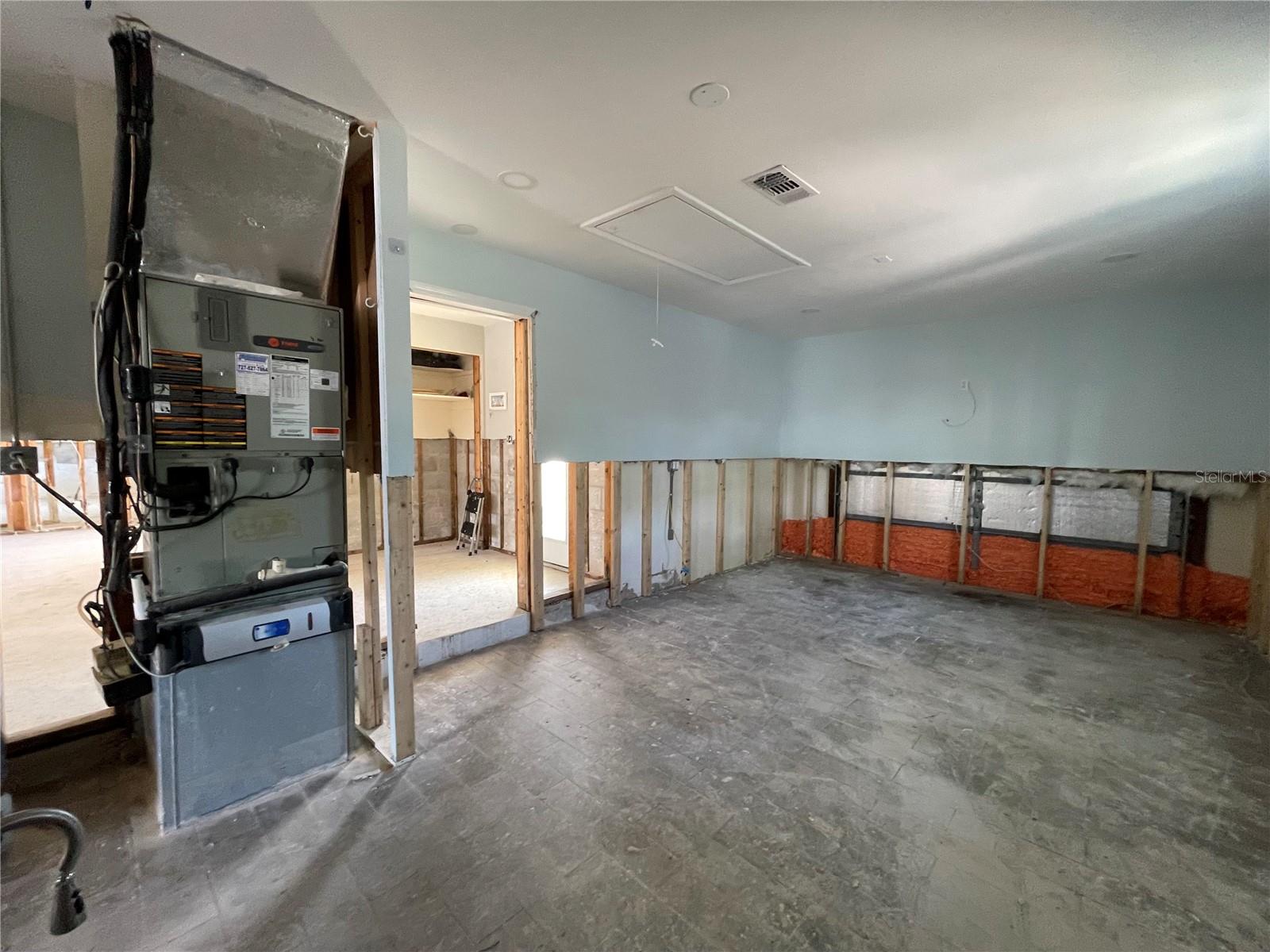 Garage area that has been converted into living space.