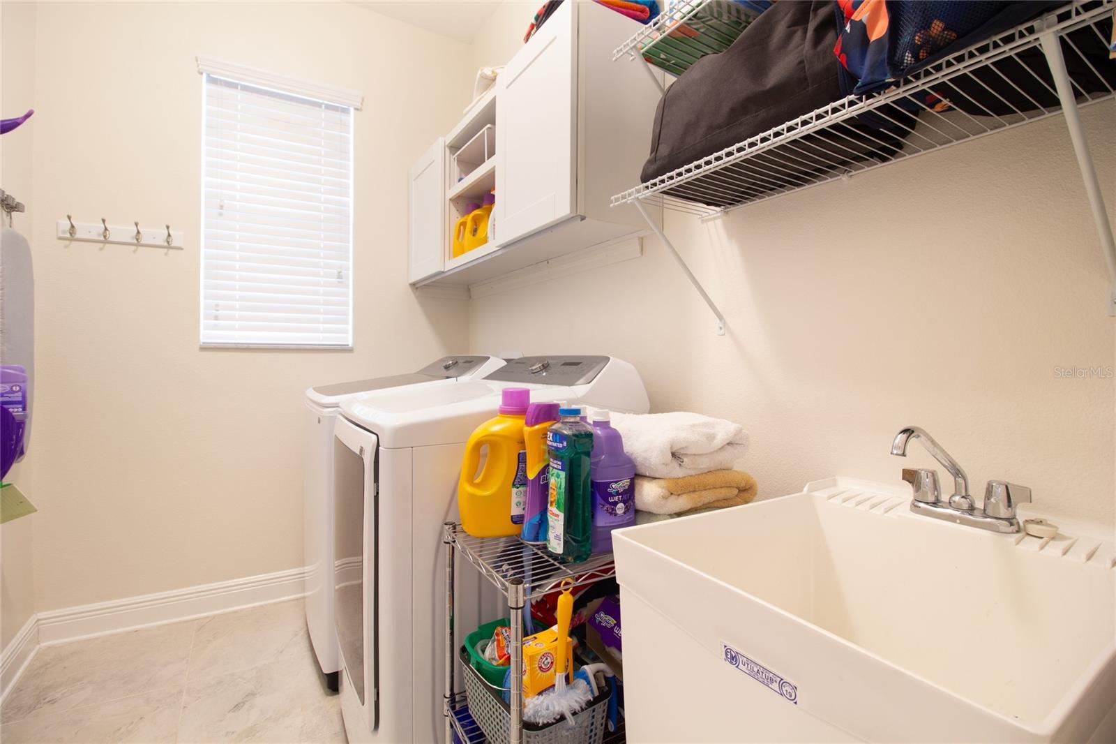 Laundry Room w/ Storage and Tub Sink