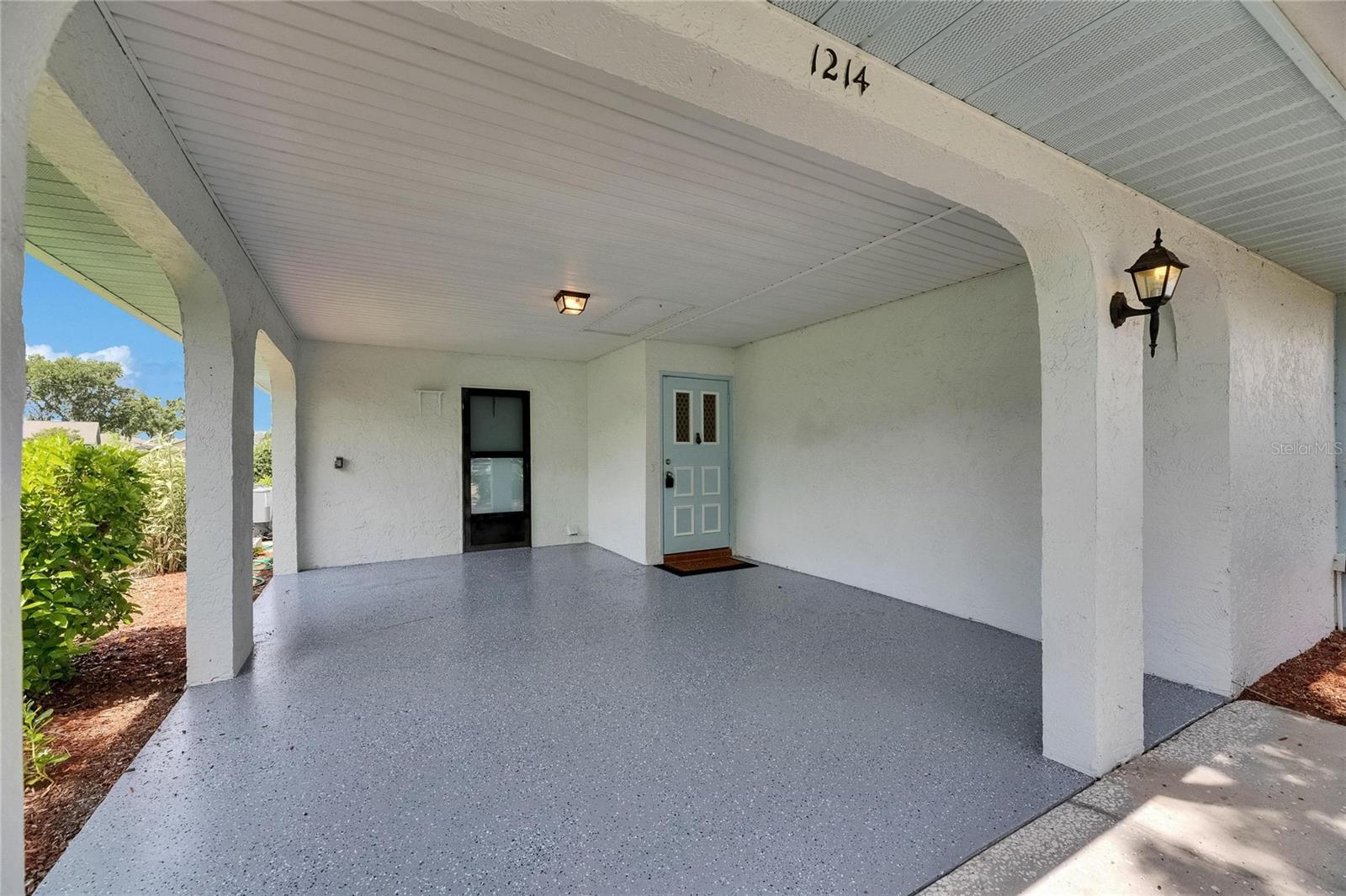 Freshly sealed & painted carport