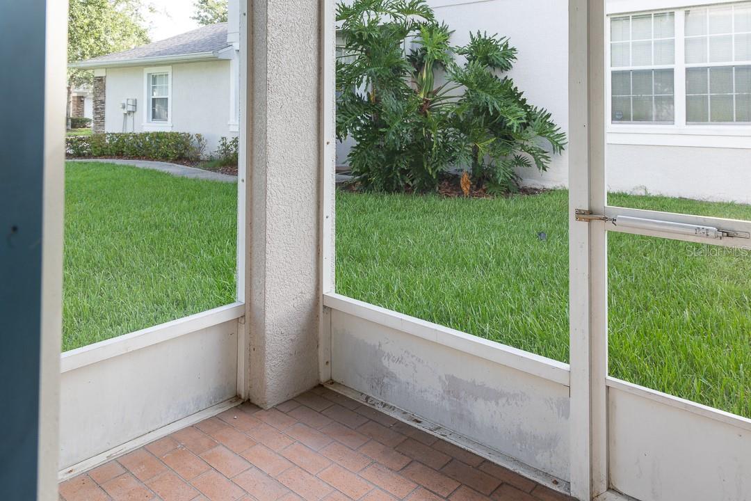 Rear covered and enclosed lanai with waterview