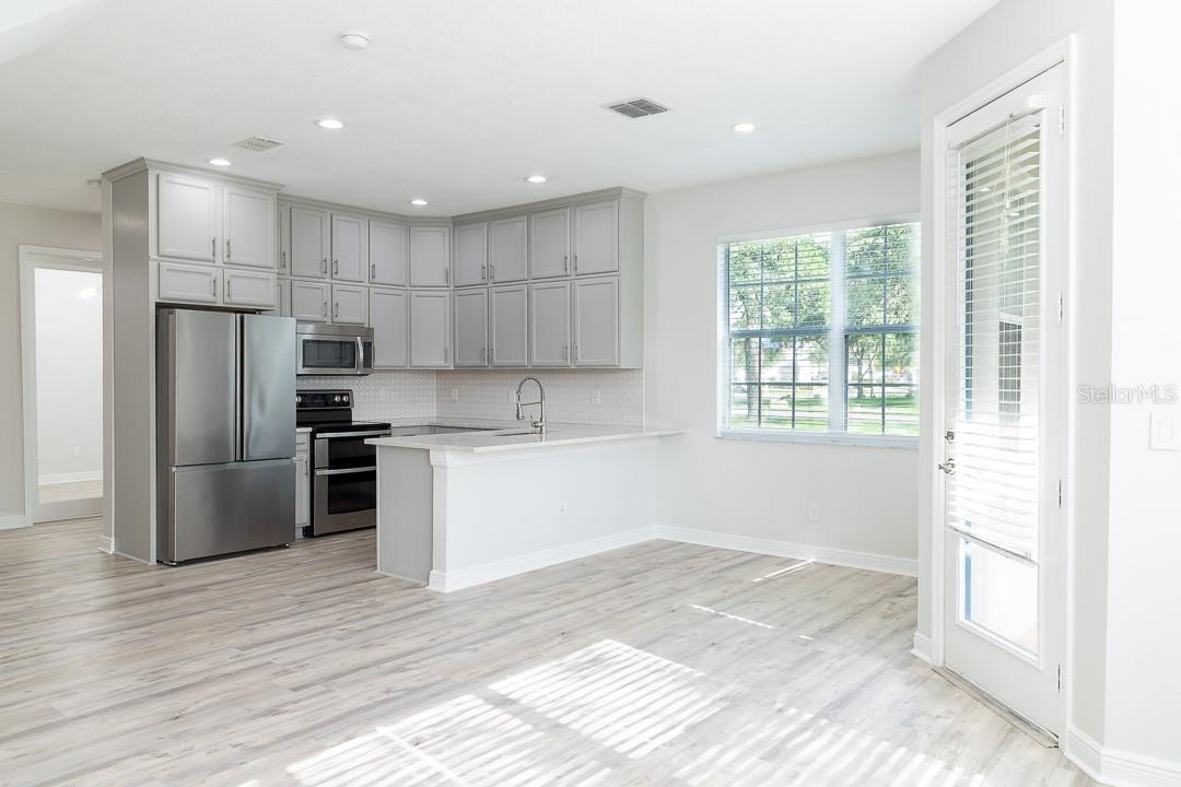 Desired open floor plan with bar seating area