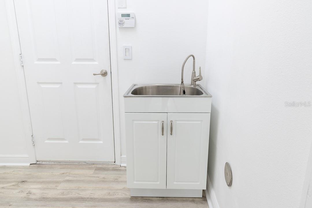 Laundry room with utility sink. Washer and Dryer hookup only.