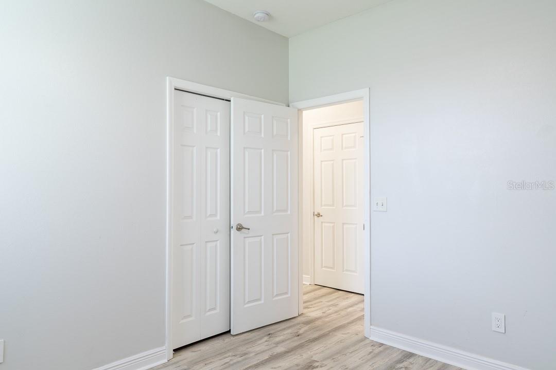 Bedroom #2 view of hallway and hallway closet