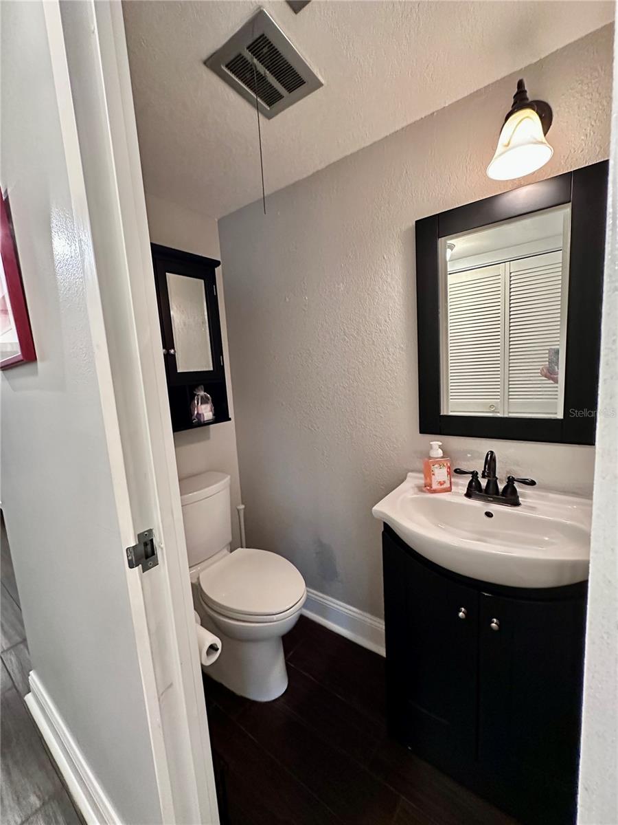 Half bathroom is located between the kitchen and the dining room
