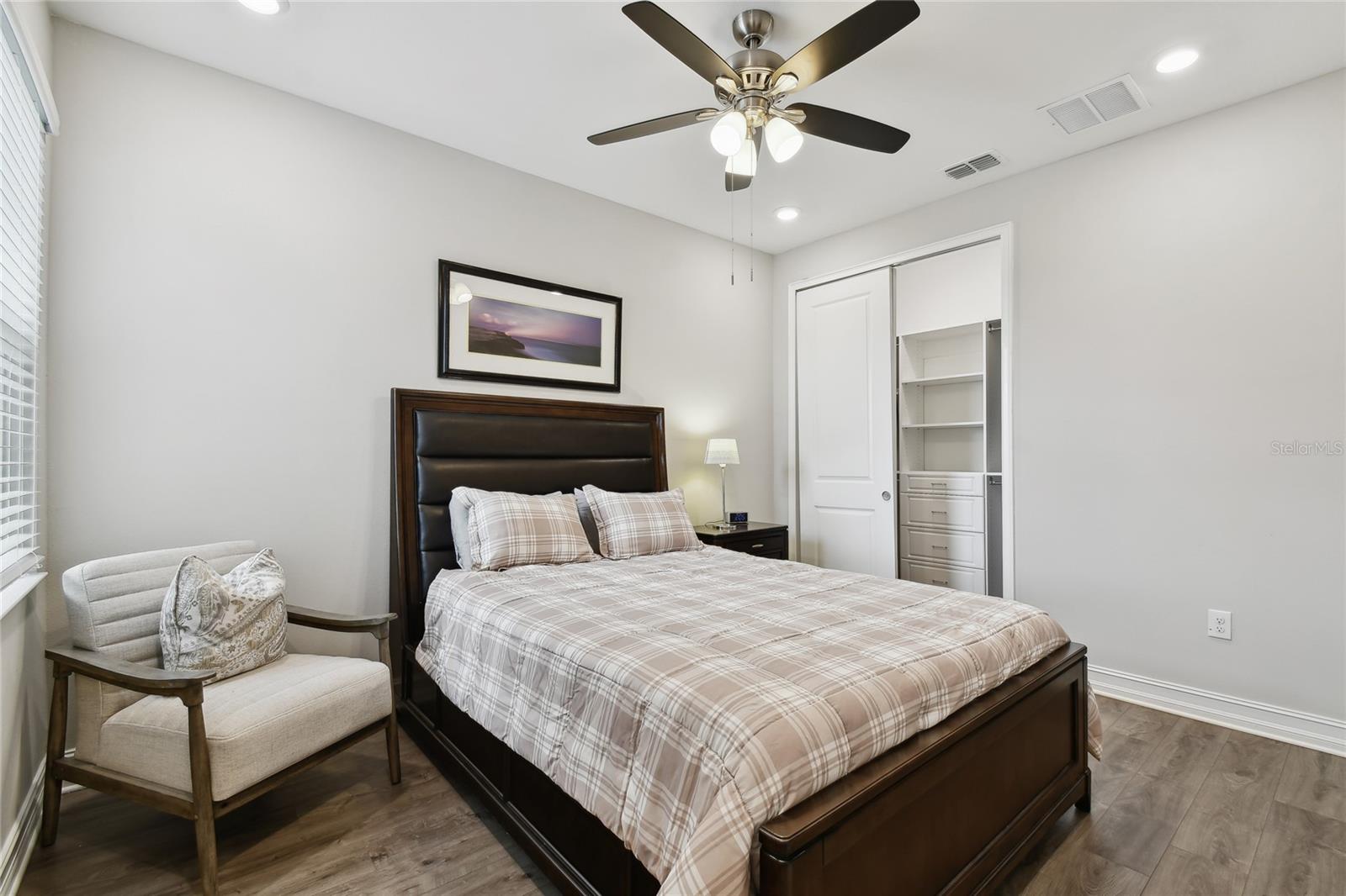 GUEST BEDROOM WITH CUSTOM SHELVING CLOSET