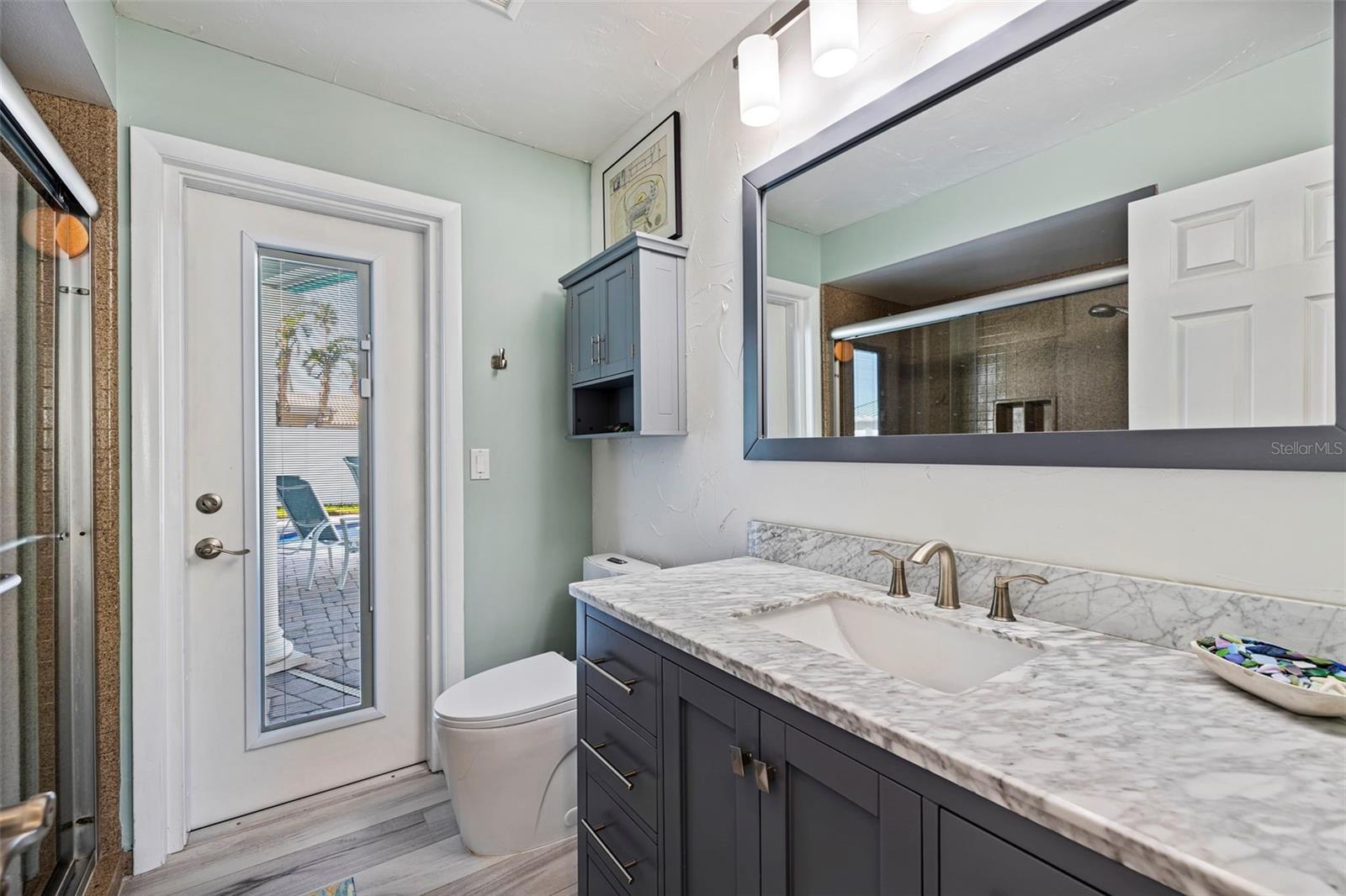 Hall Bathroom with access to pool