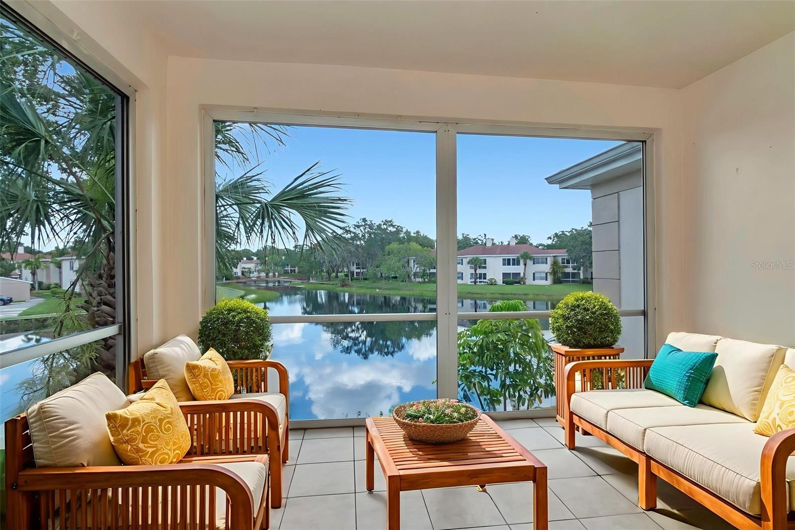 Large lanai overlooking the serene pond- Virtual staging