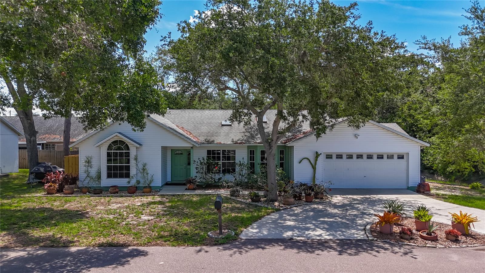 Custom Built in 1992. 3 bedrooms, 2 baths, oversized 2 car garage, inground pool/spa 1706 SF, Unincorporated Pinellas County. Next to Joe's Creek with a convenient circular drive.