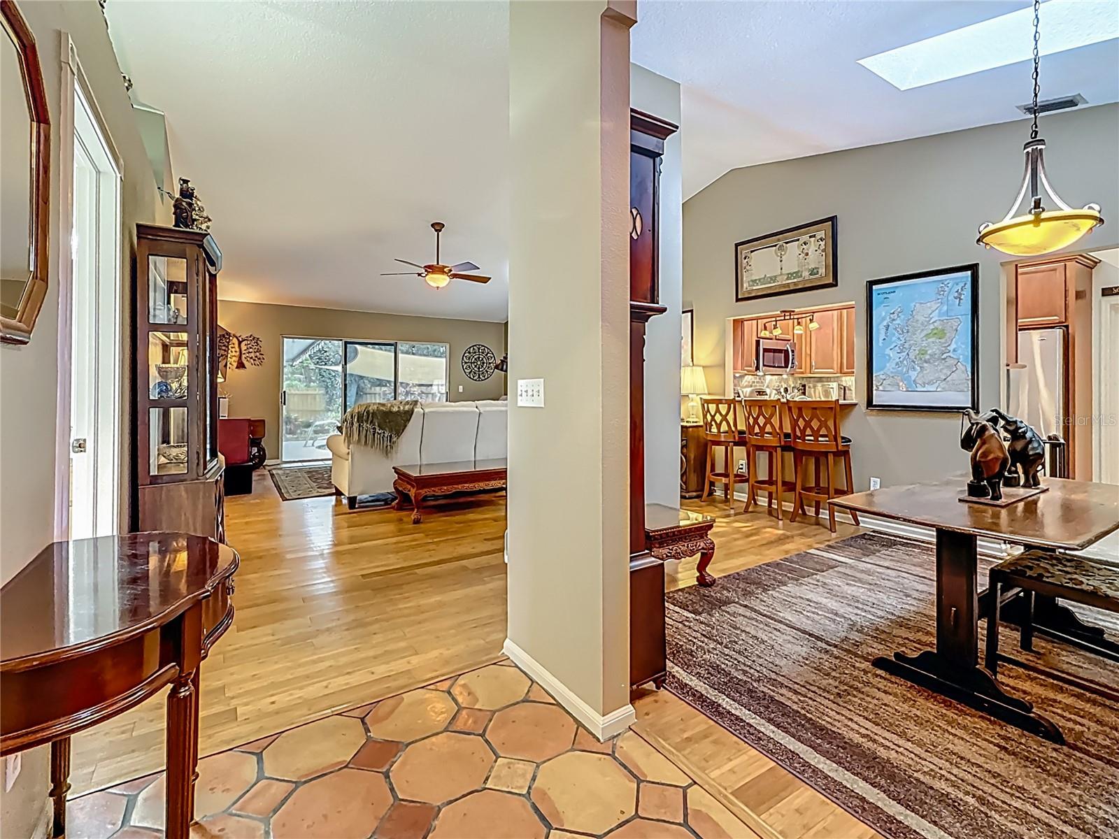 Your back is to the front door, view to the right into the dining room and beyond that is the kitchen. Did you notice the skylight in the dining room?