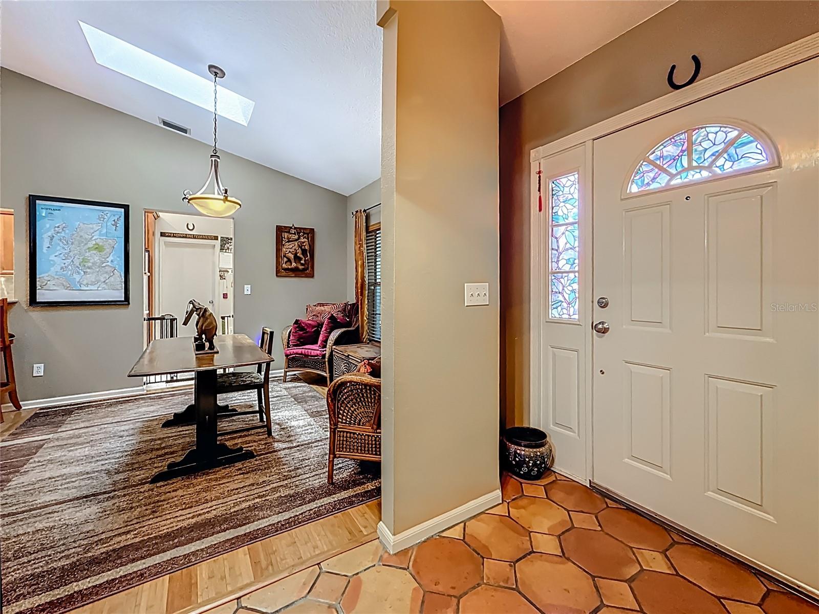 Your back is to the door of Bedroom 2, view towards the dining room & front door.