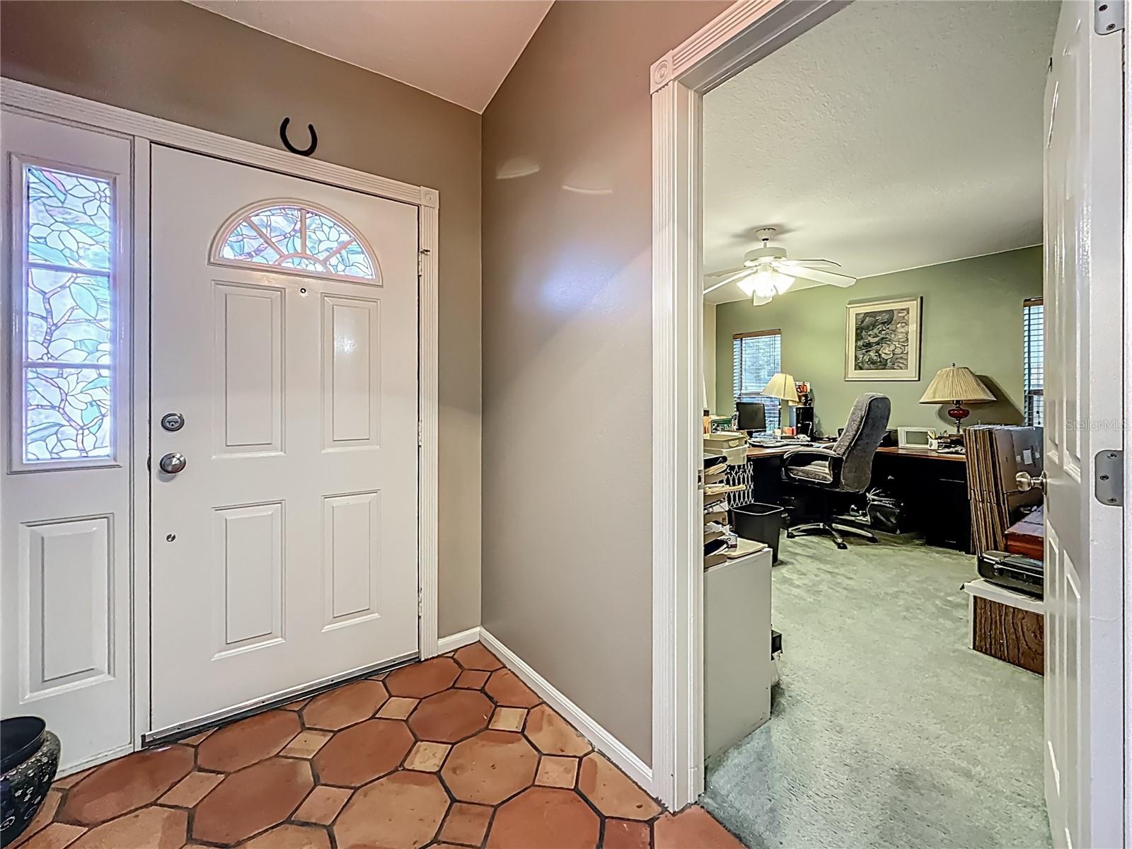 Your back is to the dining room, view towards front door & bedroom #2. ( currently being used as an office)