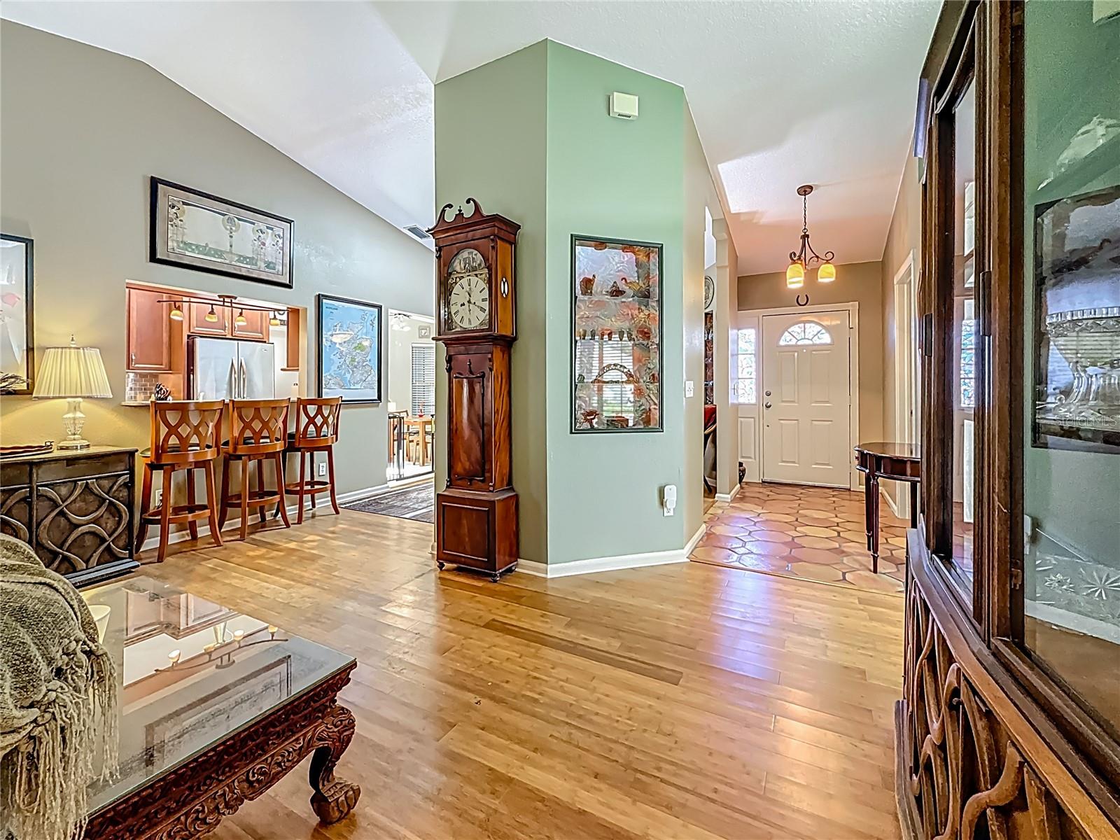 Behind you is the door to bedroom 3, view towards the breakfast bar to the left and front door to your right. Did you notice the nice size of the foyer?