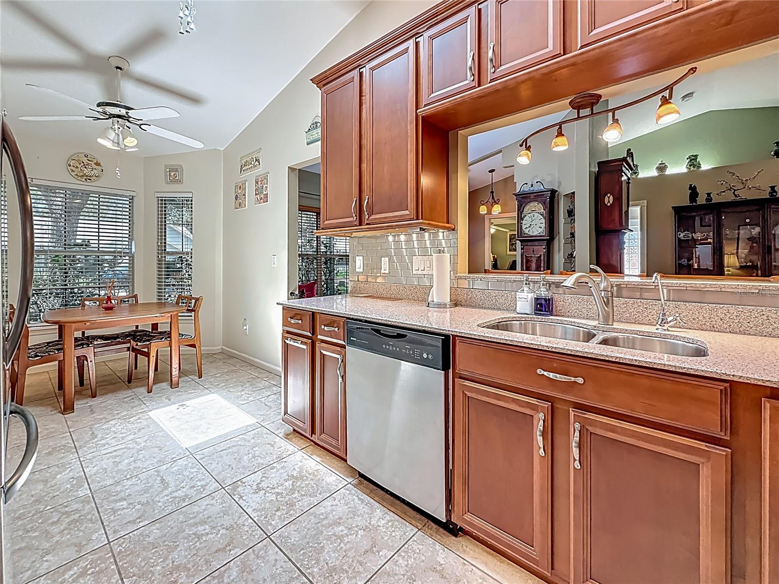 Behind you is the propane gas range, view towards the eating space in the kitchen. That is a bay window past the dinette. There is also a skylight in the kitchen.