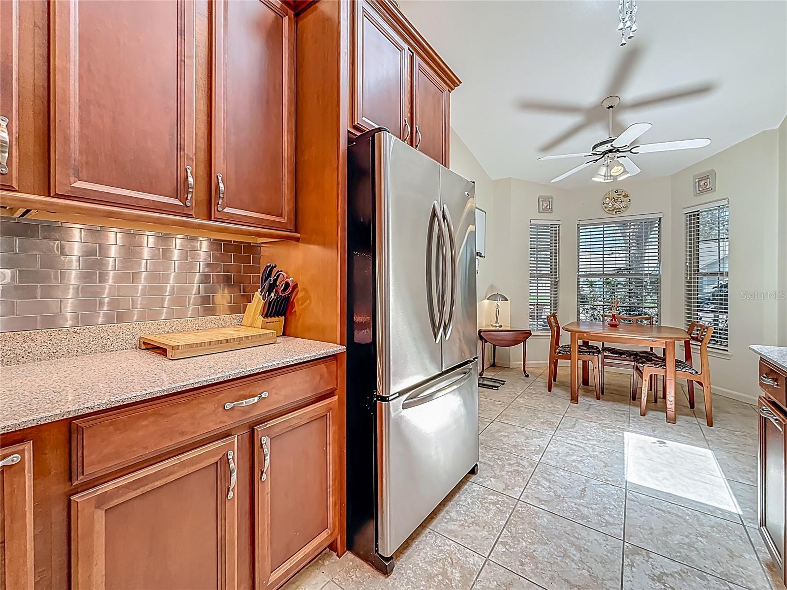 Behind you is the propane gas range, long view of kitchen.