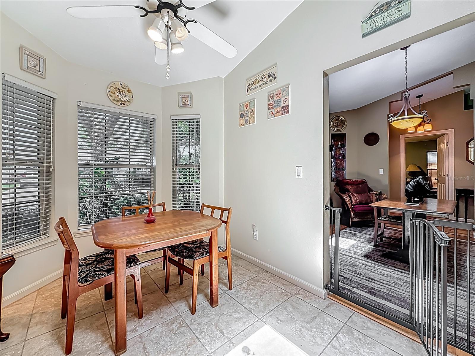 Breakfast area in kitchen.  Bay style windows. To your right is the dining room. To your immediate left is the pedestrian door into the garage.