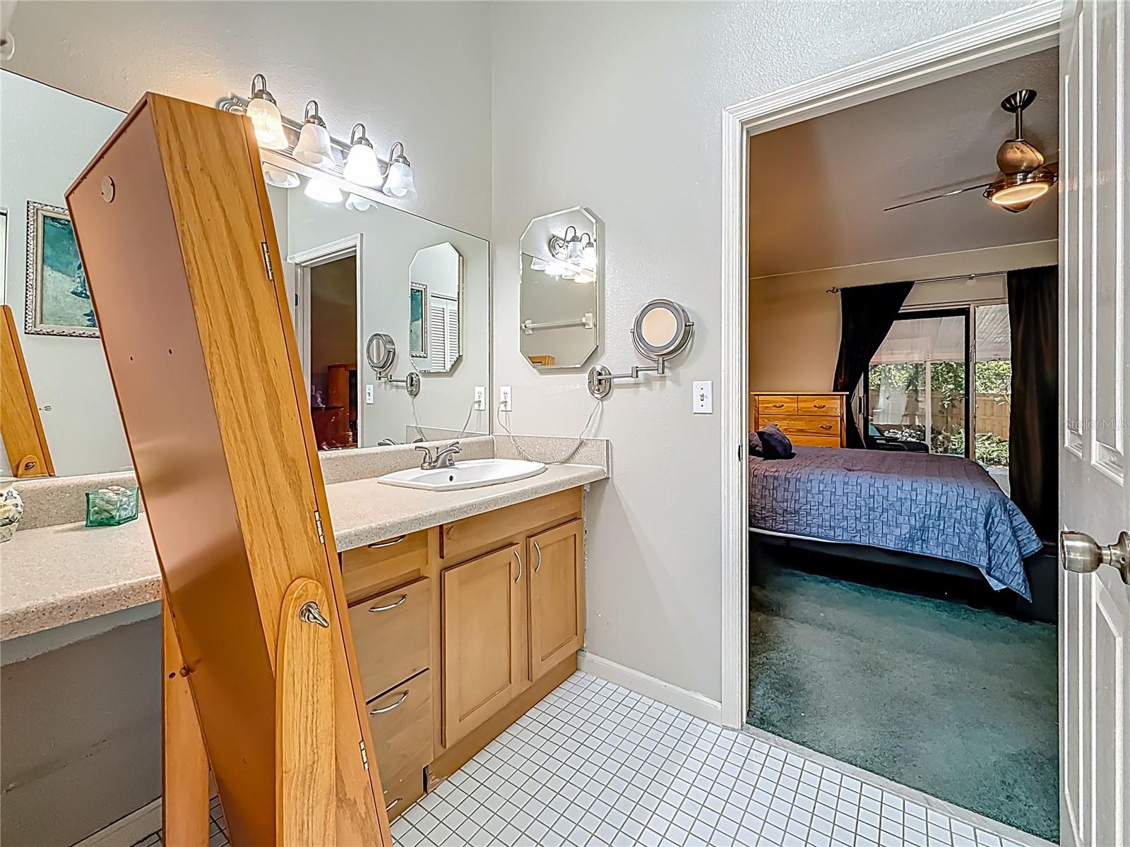 The garden tub is to your left, view into 2nd vanity area then into Bedroom 3.