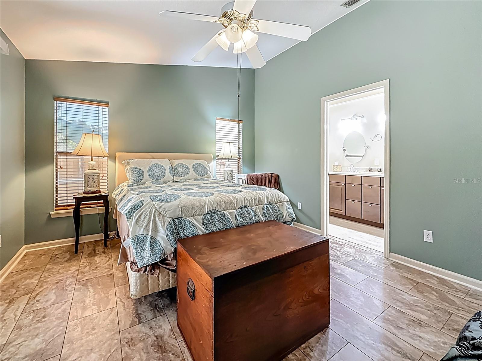 Your back is to the walk-in closet. Have you noticed the vaulted ceiling in here? The flooring is Luxury Vinyl.