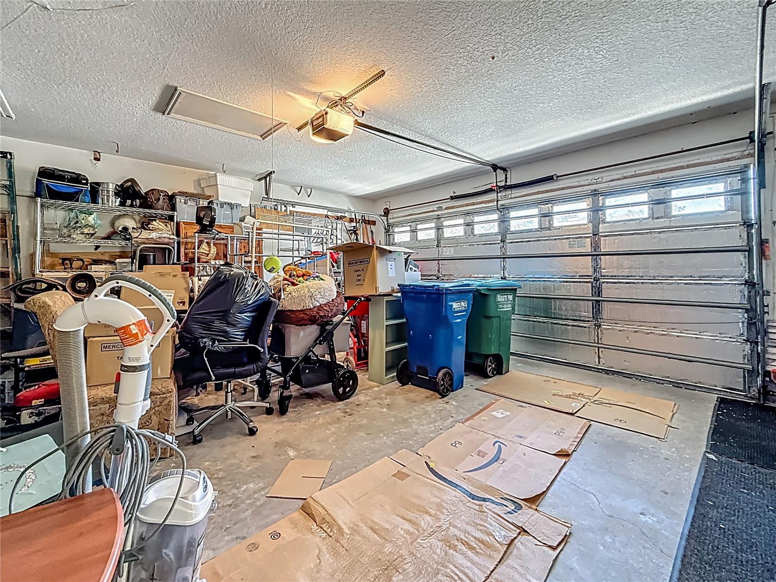 We made our way to the garage. Yes, lots of items. But they will be out when you own it ;-) ALSO: Hurricane braces for the garage door are included.