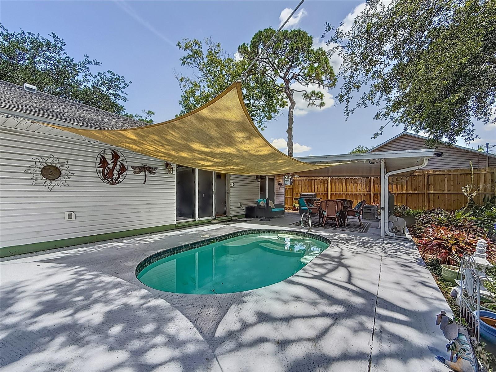 To your left- out of view- is additional decking space. The salt-water pool equipment is on that side.