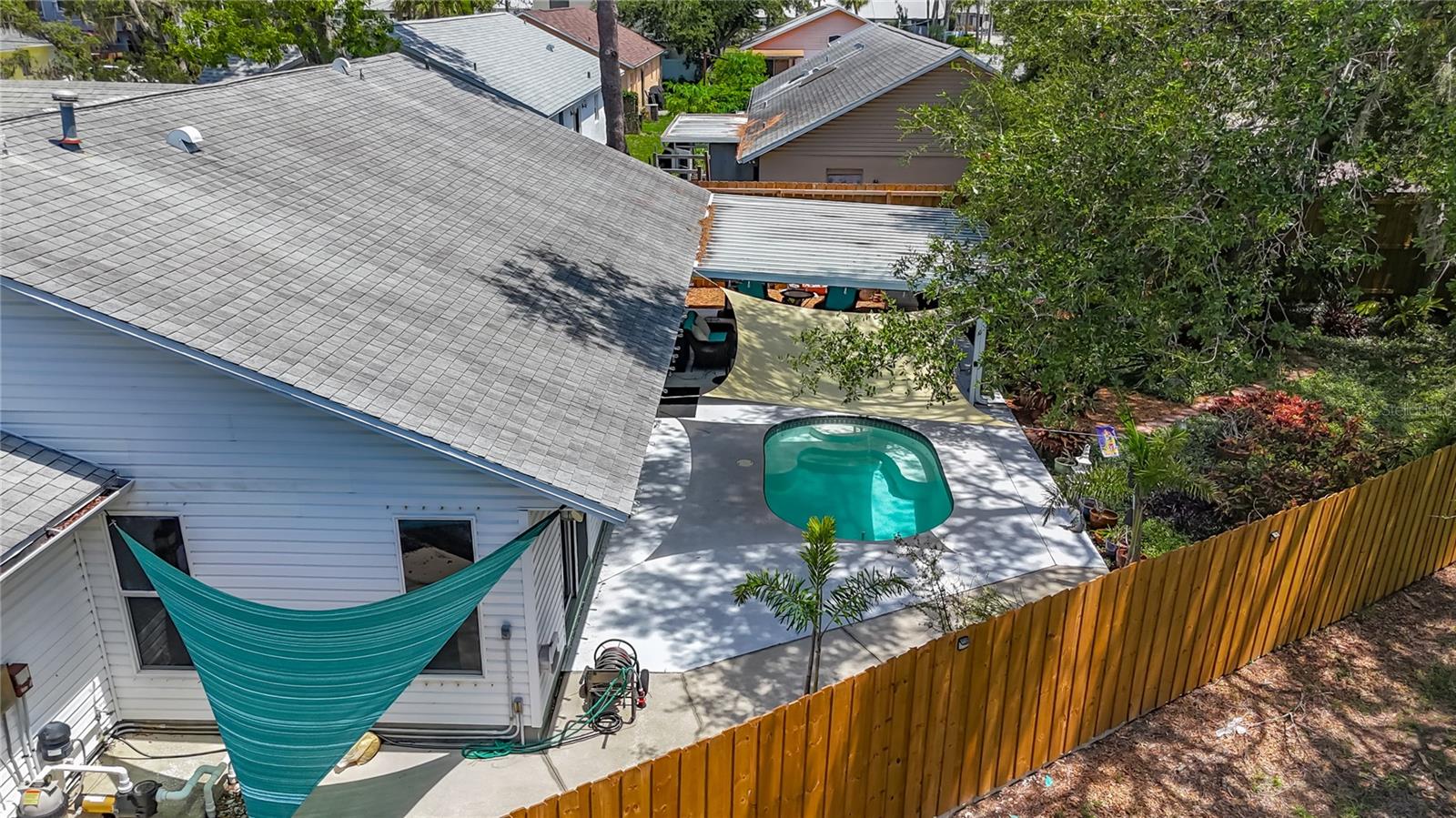 Oh my, I almost forgot to mention! The pool pump was recently replaced. This view shows the extra deck area on the south side of the house.